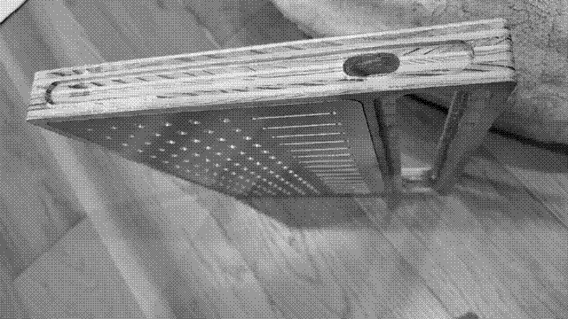 A side view of the mixer. A roughly one centimeter channel has been routed into the edge, as close to 3.2 millimeters deep as I could manage. In the middle of this channel, at the point where the faceplate and miniplate meet, a roughly five millimeter by two and a half centimeter hole has been routed all the way through and into the main cavity of the mixer.